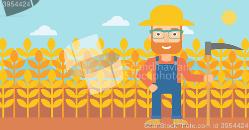 Image of Farmer on the field with scythe.