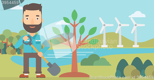 Image of Man plants tree.