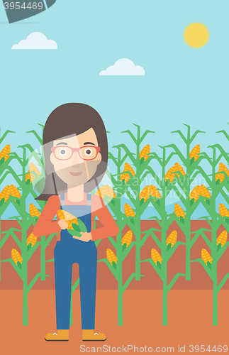 Image of Farmer holding corn.