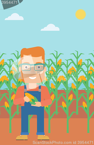 Image of Farmer holding corn.