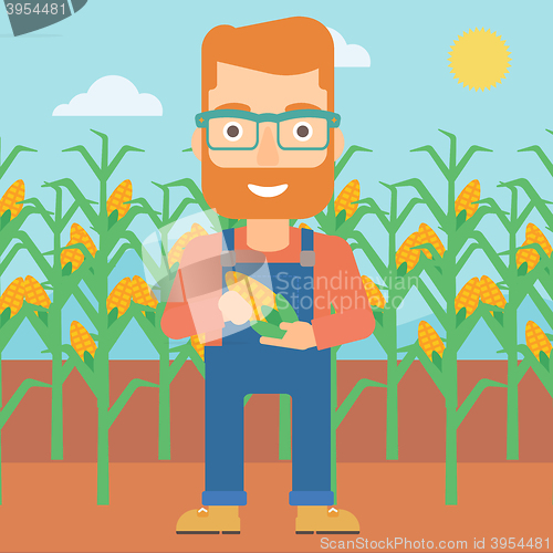 Image of Farmer holding corn.