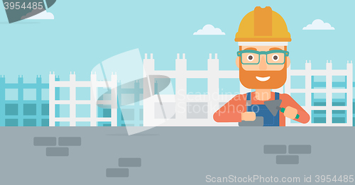 Image of Bricklayer with spatula and brick.