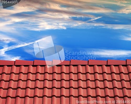 Image of Roof tiles and sunset sky