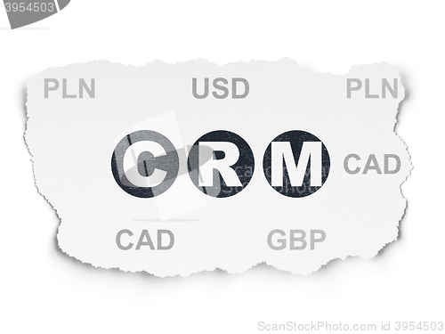 Image of Business concept: CRM on Torn Paper background