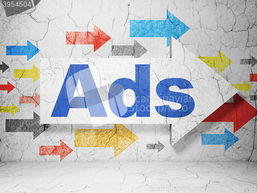 Image of Marketing concept: arrow with Ads on grunge wall background