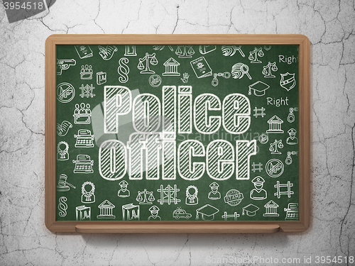 Image of Law concept: Police Officer on School board background