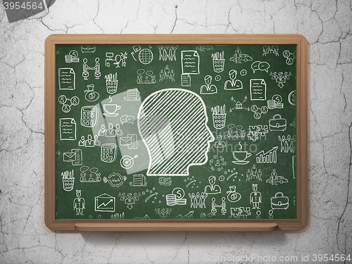 Image of Finance concept: Head on School board background