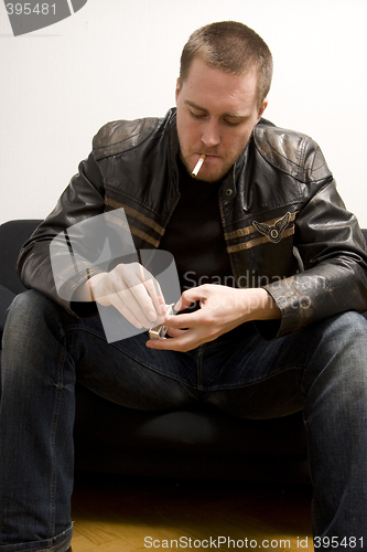 Image of man smoking a cigarette