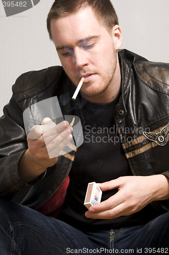 Image of man smoking a cigarette