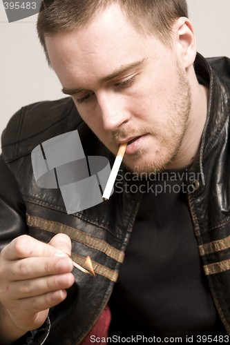 Image of man smoking a cigarette