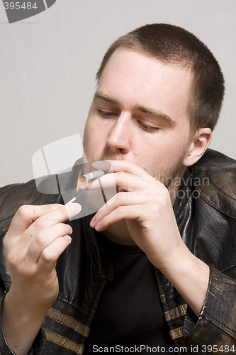 Image of man smoking a cigarette