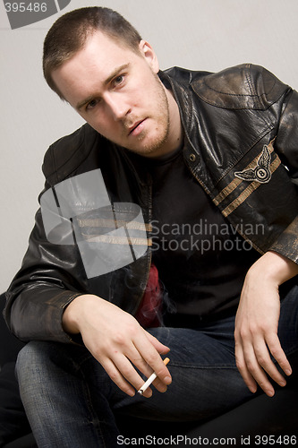 Image of man smoking a cigarette
