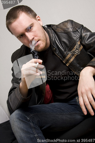 Image of man smoking a cigarette