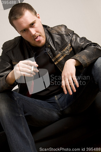 Image of man smoking a cigarette