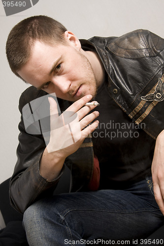 Image of man smoking a cigarette