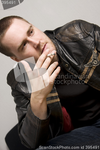 Image of man smoking a cigarette