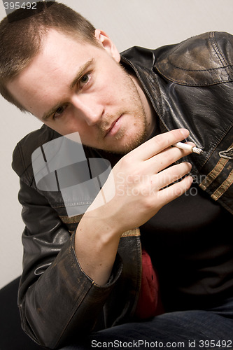 Image of man smoking a cigarette