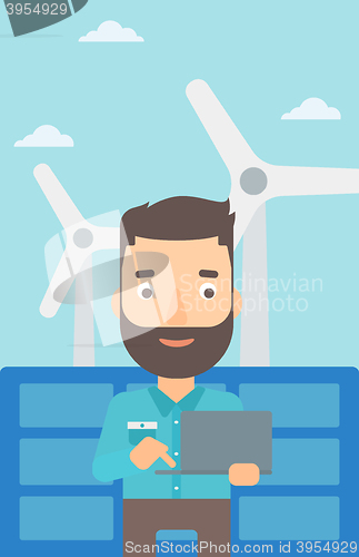 Image of Man using laptop.