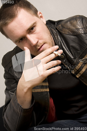 Image of man smoking a cigarette