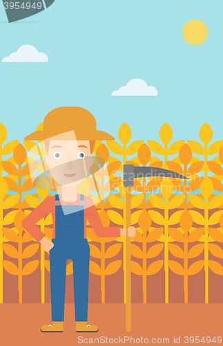 Image of Farmer on the field with scythe.