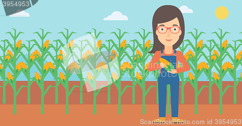 Image of Farmer holding corn.