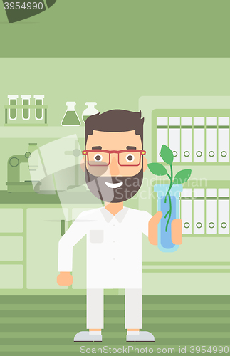 Image of Laboratory assistant with test tube.
