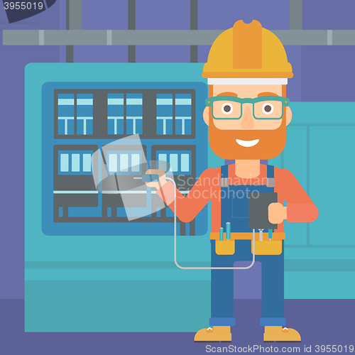 Image of Electrician with electrical equipment.