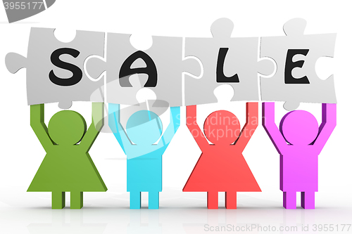 Image of Four people hold puzzle with sale word