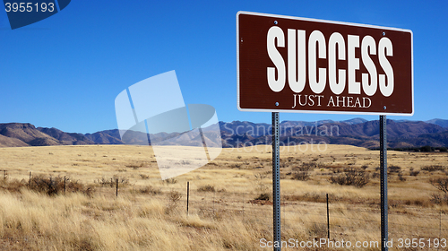 Image of Success Just Ahead brown road sign