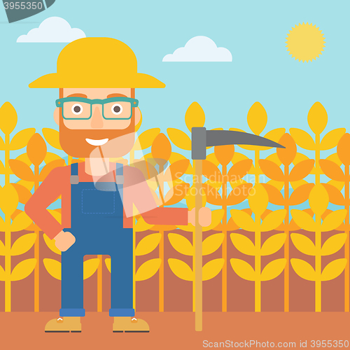Image of Farmer on the field with scythe.
