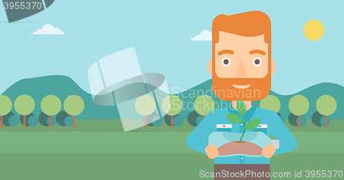 Image of Man with plant growing in bottle.