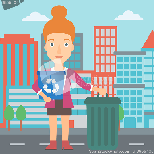 Image of Woman with recycle bins.