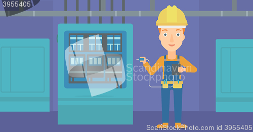 Image of Electrician with electrical equipment.