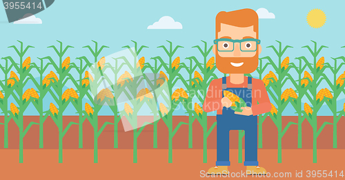 Image of Farmer holding corn.