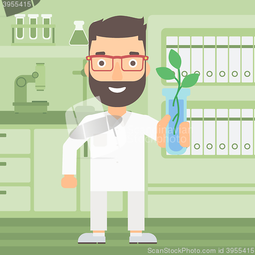 Image of Laboratory assistant with test tube.