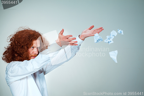 Image of Angry man tear out paper