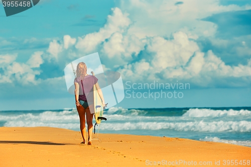 Image of Surfer girl an the beach