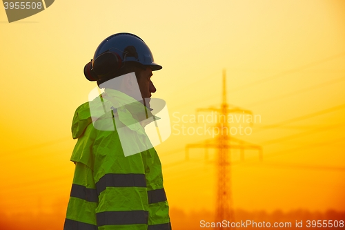 Image of Worker at the sunset