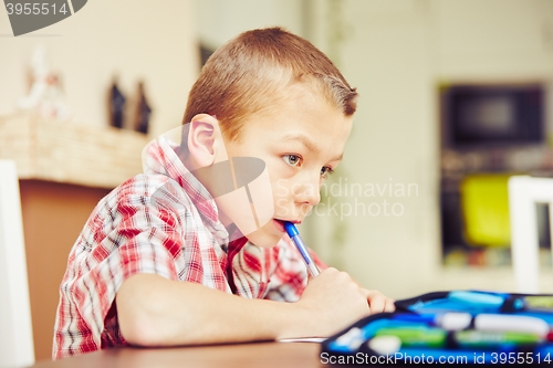 Image of Boy is doing homework 