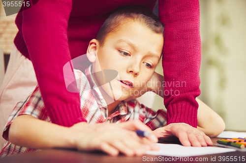 Image of Boy is doing homework 