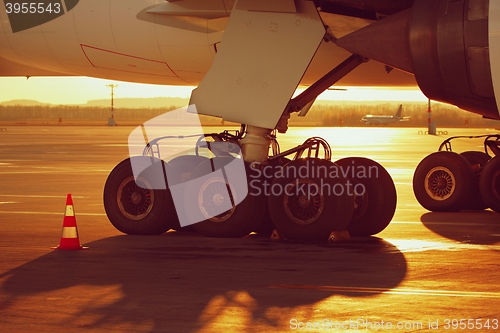 Image of Wheels of the airplane at the sunset