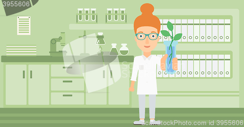 Image of Laboratory assistant with test tube.