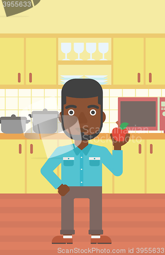 Image of Man holding apple.