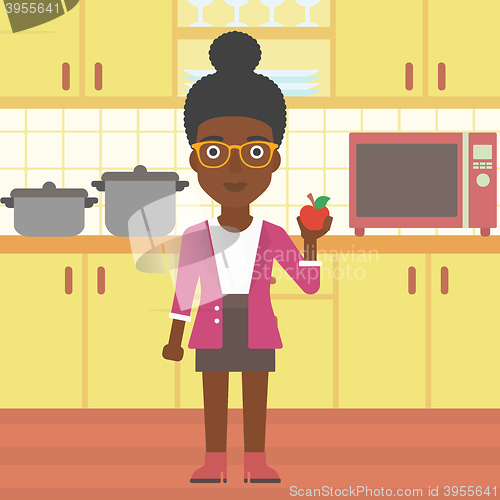 Image of Woman holding apple.