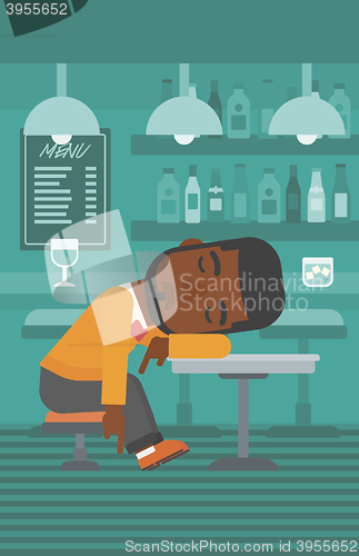 Image of Man sleeping in bar. 