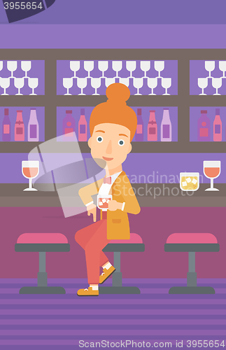 Image of Woman sitting at bar.