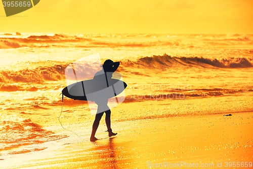 Image of Silhouette of the surfer girl 