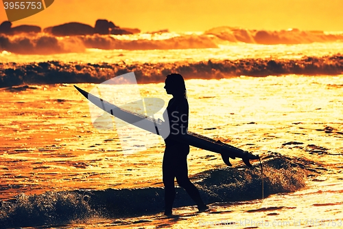 Image of Silhouette of the surfer girl 