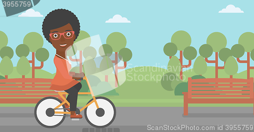 Image of Woman riding bicycle.