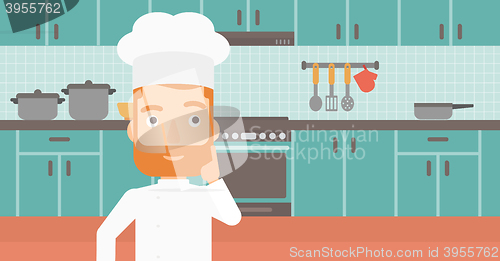 Image of Chef pointing forefinger up.